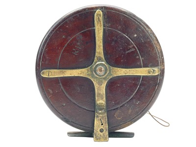 Lot 14 - A Brass and mahogany sea fishing reel.