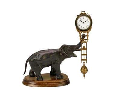 Lot 471 - A bronzed spelter elephant mystery timepiece.