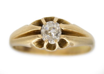 Lot 89 - A late Victorian high purity gold diamond set solitaire ring.
