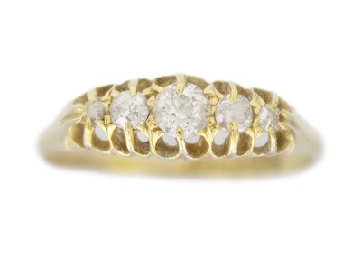 Lot 91 - An Edwardian 18k gold five-stone diamond set ring.