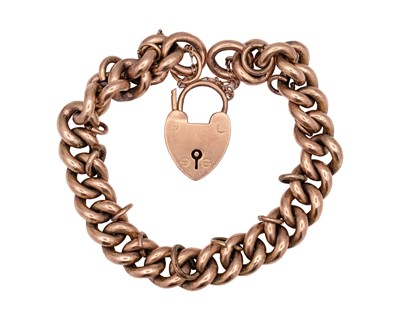 Lot 93 - A 9k rose gold chunky curb bracelet with a heart-shaped padlock clasp.
