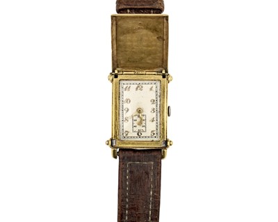 Lot 1094 - RECTA - A rare 18k Art Deco 'Hunting' or concealed dial wristwatch.