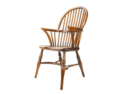 Lot 499 - An ash and elm hoop back child's Windsor chair.