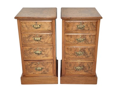 Lot 515 - A pair of Edwardian walnut pedestal chests.