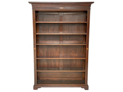 Lot 531 - A late Victorian mahogany and inlaid standing bookcase.