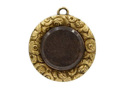 Lot 108 - An early 19th-century high-purity gold locket pendant.