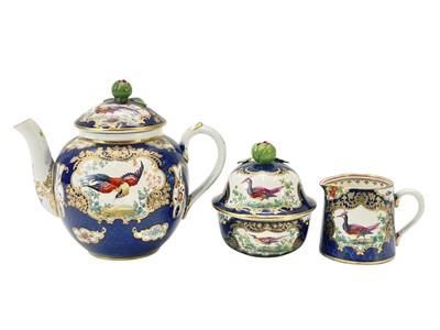 Lot 372 - A Worcester style blue scale ground teapot, sugar bowl and milk jug.