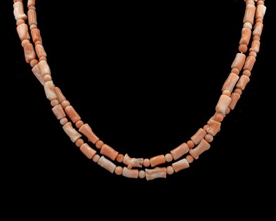 Lot 49 - A blush pink coral necklace with a 14k gold clasp.