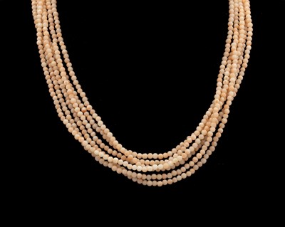 Lot 50 - A three-strand blush pink coral necklace.