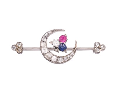 Lot 103 - A higher purity white gold, diamond, sapphire, and ruby set crescent bar brooch.