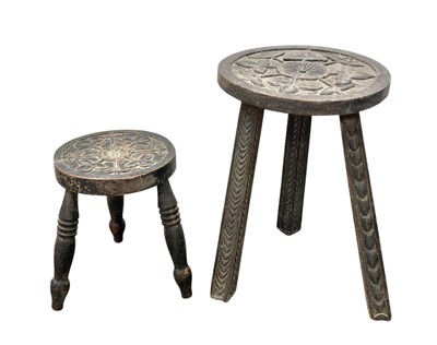 Lot 513 - A folk art carved oak small occasional table or stool.