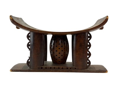 Lot 63 - A carved hardwood Ashanti stool.