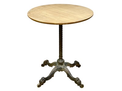 Lot 522 - A late Victorian cast iron and brass occasional table.