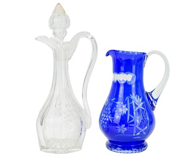 Lot 373 - A blue overlay glass jug.