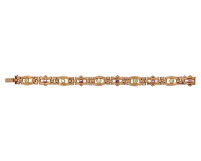 Lot 165 - Edwardian 15k gold pink sapphire and peridot bracelet in an original box by MAPPIN & WEBB Ltd.