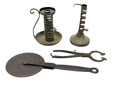 Lot 23 - A French 'rat de cave' wrought iron candlestick.