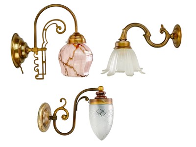 Lot 489 - Three brass wall lights.