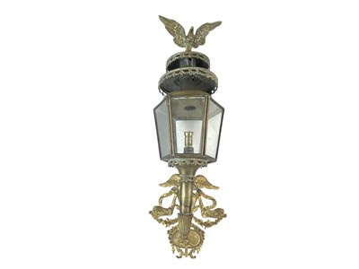 Lot 484 - An ornate brass wall lamp.