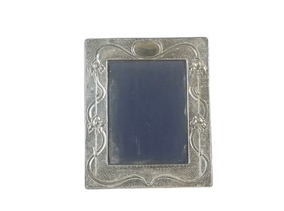 Lot 250 - An Edwardian Art Nouveau silver easel photograph frame of rectangular form.