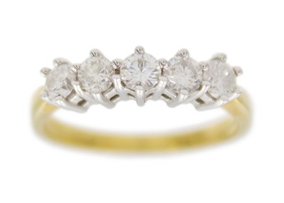Lot 169 - An 18k gold five-stone diamond set ring.