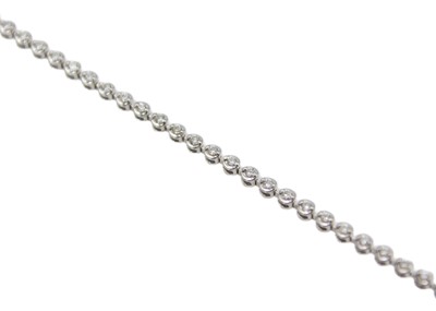 Lot 125 - An 18k white gold diamond-set tennis bracelet in an original 'Michael Spiers' box.