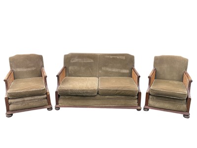 Lot 537 - A mahogany framed three piece bergere suite.
