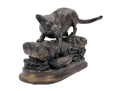 Lot 7 - After Jules Moigniez, a small bronze feline figure.