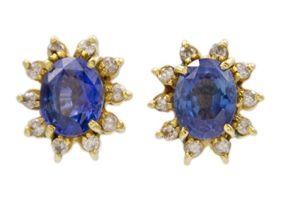Lot 150 - An 18k gold sapphire and diamond cluster stud earrings.