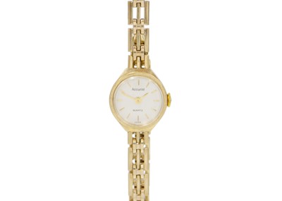 Lot 161 - A 9k gold 'ACCURIST' quartz ladies' bracelet wristwatch.