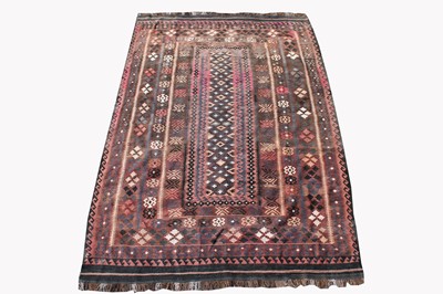 Lot 499E - A Persian kelim, the brown field with a large...