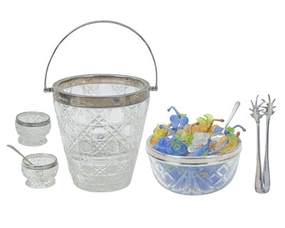 Lot 247 - An Edwardian cut glass ice bucket with silver rim, handle and strainer.