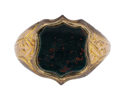 Lot 175 - A Victorian 9k gold bloodstone set signet ring.