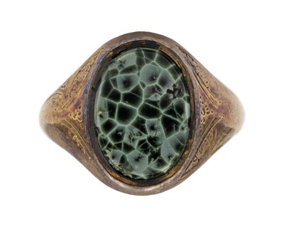 Lot 176 - A 14k gold Isle Royale Greenstone (chlorastrolite - the state gemstone of Michigan, USA) set signet ring.