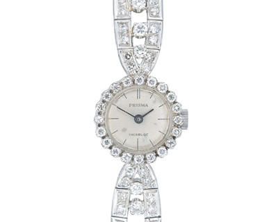 Lot 1209 - An 18k white gold diamond set lady's cocktail bracelet wristwatch.