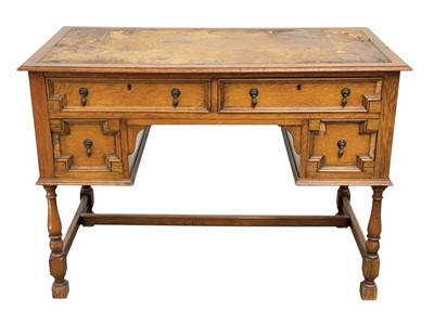 Lot 910 - A Carolean revival oak desk.