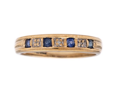 Lot 110 - A 9k gold diamond and sapphire set band ring.