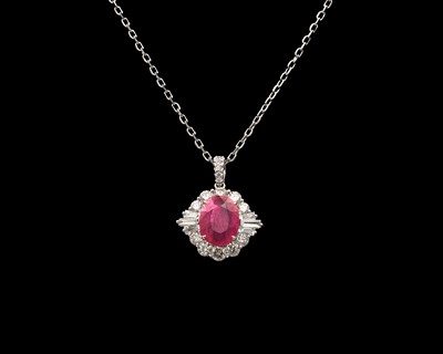 Lot 148 - An 18k white gold ruby and diamond cluster pendant on a chain.