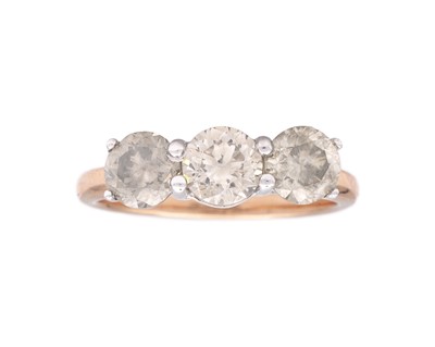 Lot 181 - An 18k rose gold three-stone diamond ring.
