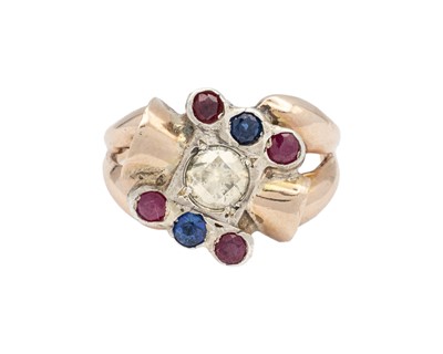 Lot 183 - A 14k gold diamond, sapphire, and ruby set ring.