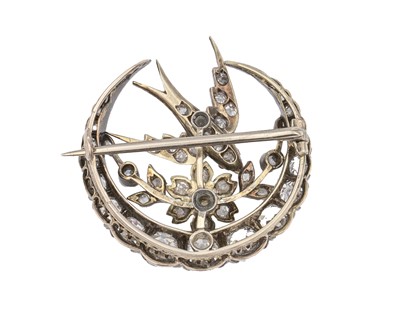 Lot 7 - A Scottish Victorian diamond and seed pearl crescent and swallow bird brooch by Aitchison.