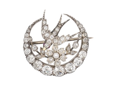 Lot 7 - A Scottish Victorian diamond and seed pearl crescent and swallow bird brooch by Aitchison.
