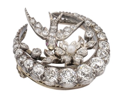 Lot 7 - A Scottish Victorian diamond and seed pearl crescent and swallow bird brooch by Aitchison.
