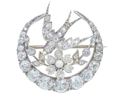 Lot 7 - A Scottish Victorian diamond and seed pearl crescent and swallow bird brooch by Aitchison.