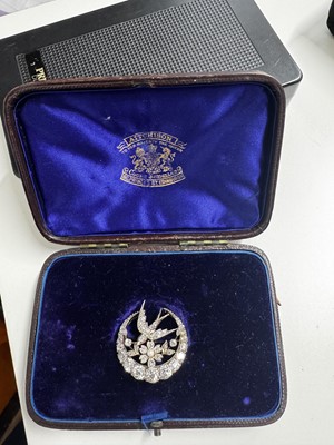 Lot 7 - A Scottish Victorian diamond and seed pearl crescent and swallow bird brooch by Aitchison.