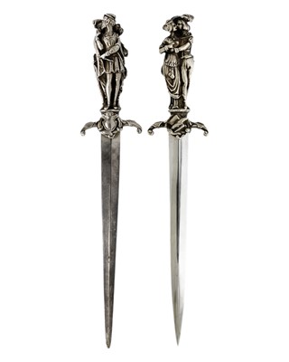 Lot 131 - A pair of well cast silver handled figural paper knives by E H Parkin & Co.