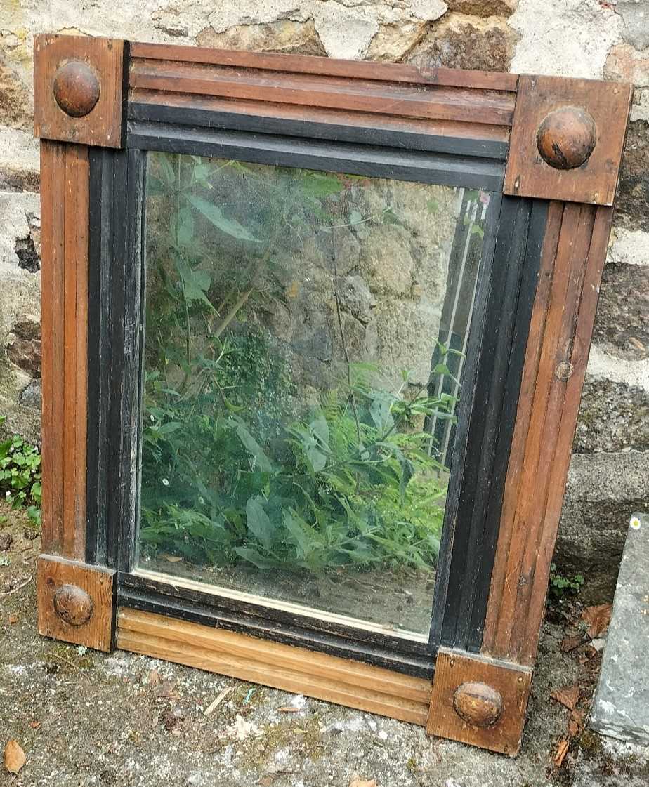 Lot 42 - A pine framed wall mirror.