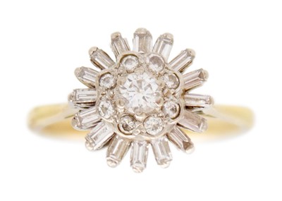 Lot 57 - An 18k gold and diamond set cluster ring.