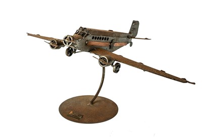 Lot 137 - A sheet steel and copper model of an aeroplane.