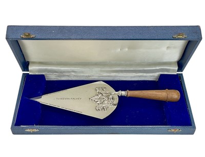 Lot 126 - An ornate silver plated presentation trowel.