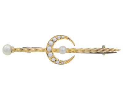 Lot 141 - A gold pearl set crescent bar brooch.